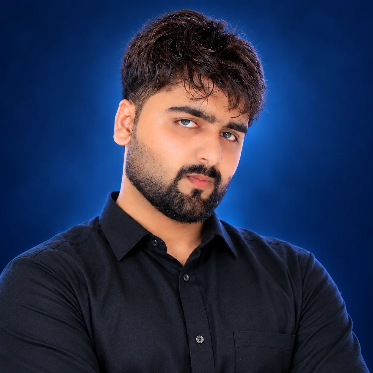 Portrait of Tayyab Amin with blue background
